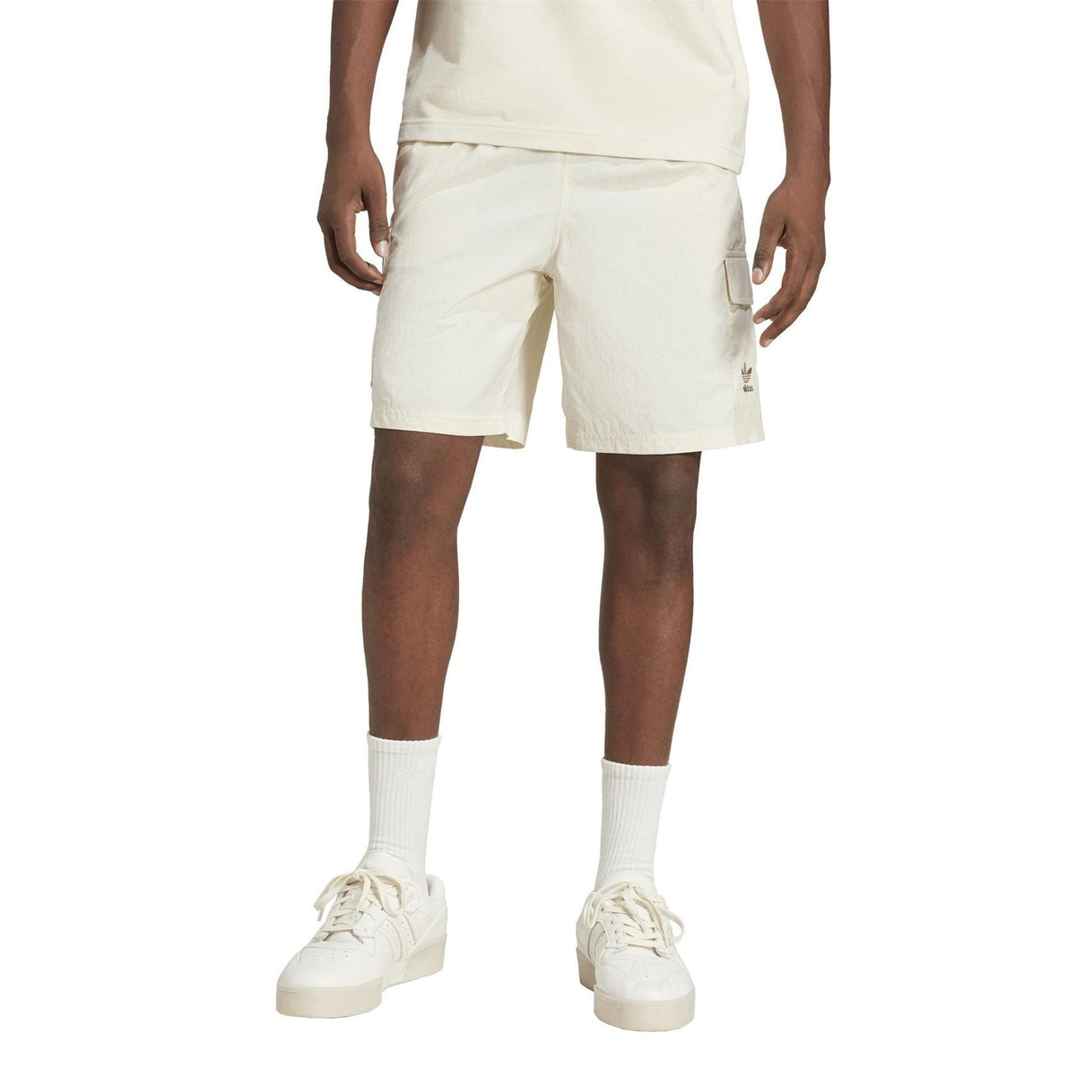 adidas Originals Essvn shorts in black with white stripes, casual athletic shorts for men or women, front view.