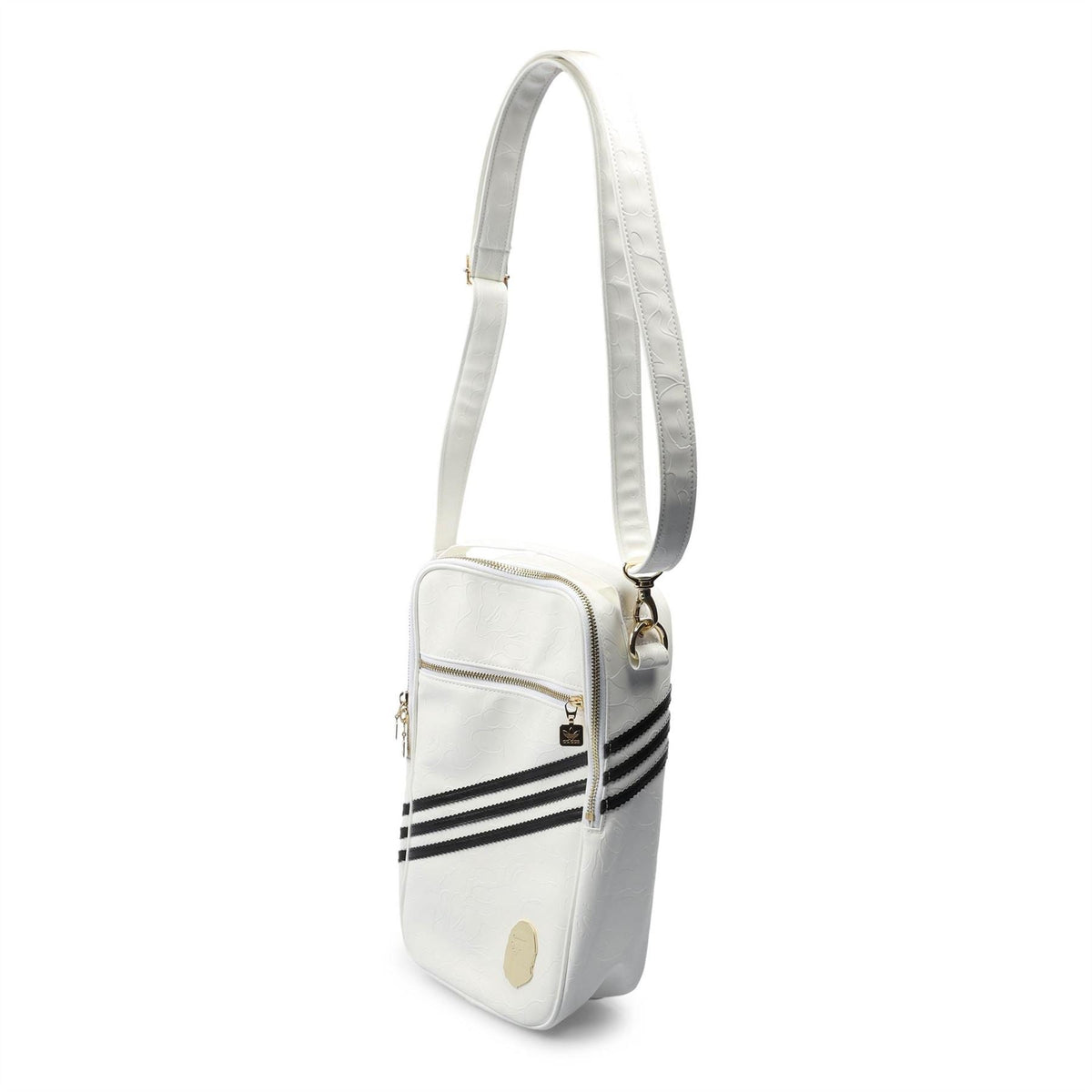 White adidas Originals BAPE crossbody bag with adjustable shoulder strap and black stripe detail