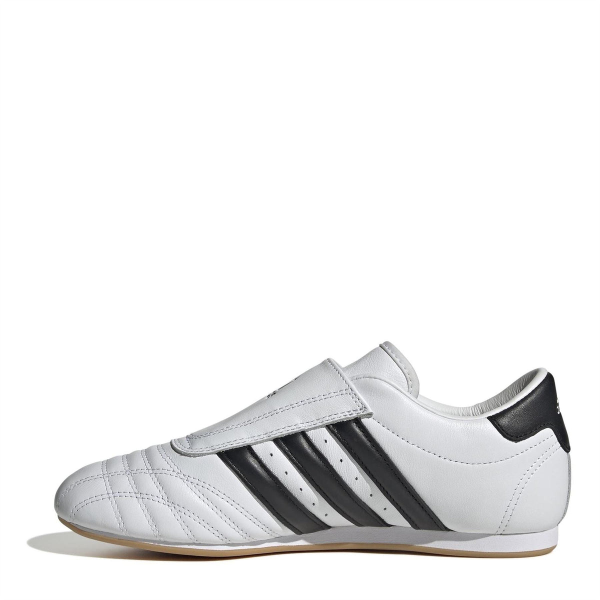 White low-top trainers with three black stripes and hook strap, gum sole