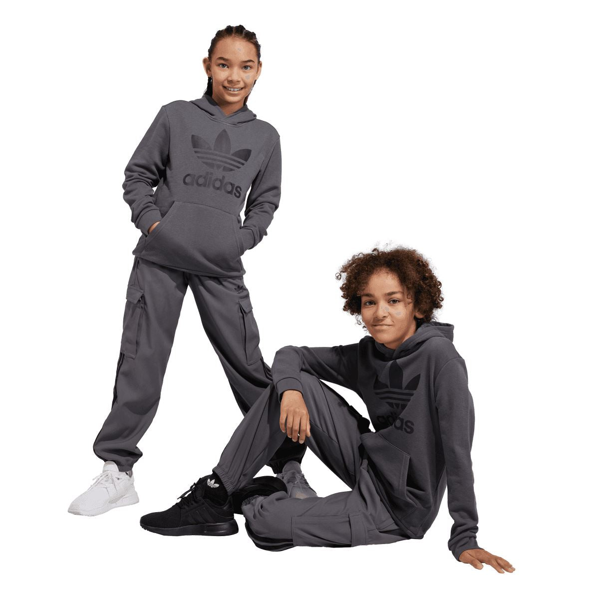 Grey junior adidas Trefoil hoodie worn with matching joggers, hood and ribbed cuffs