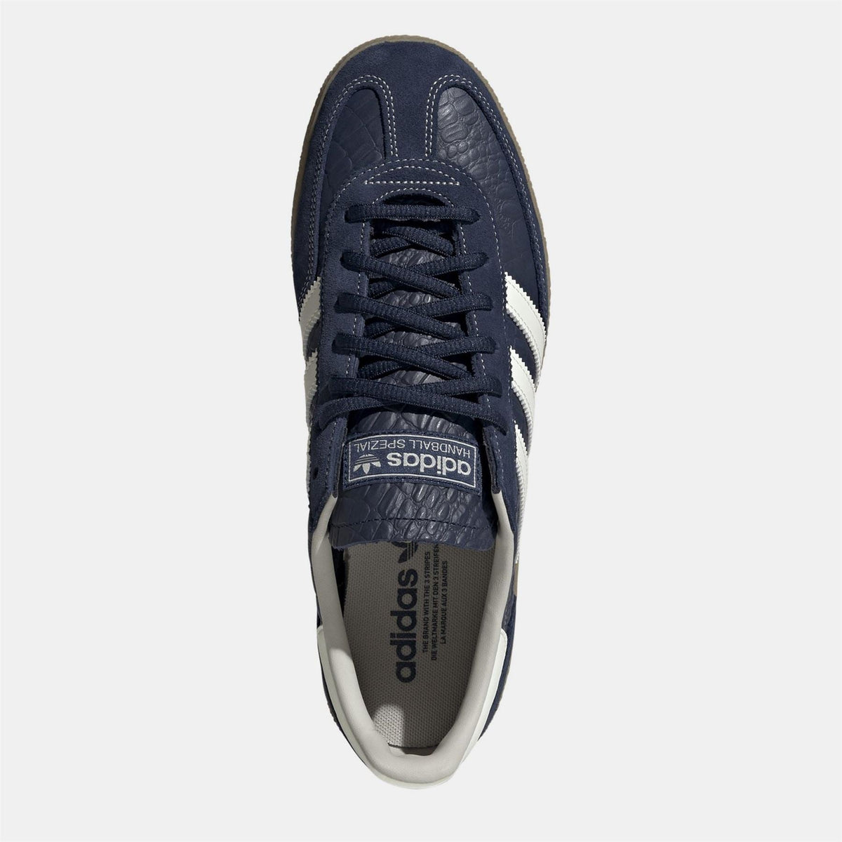 Navy adidas Spezial sneakers, top view with lace-up eyelets and padded tongue.