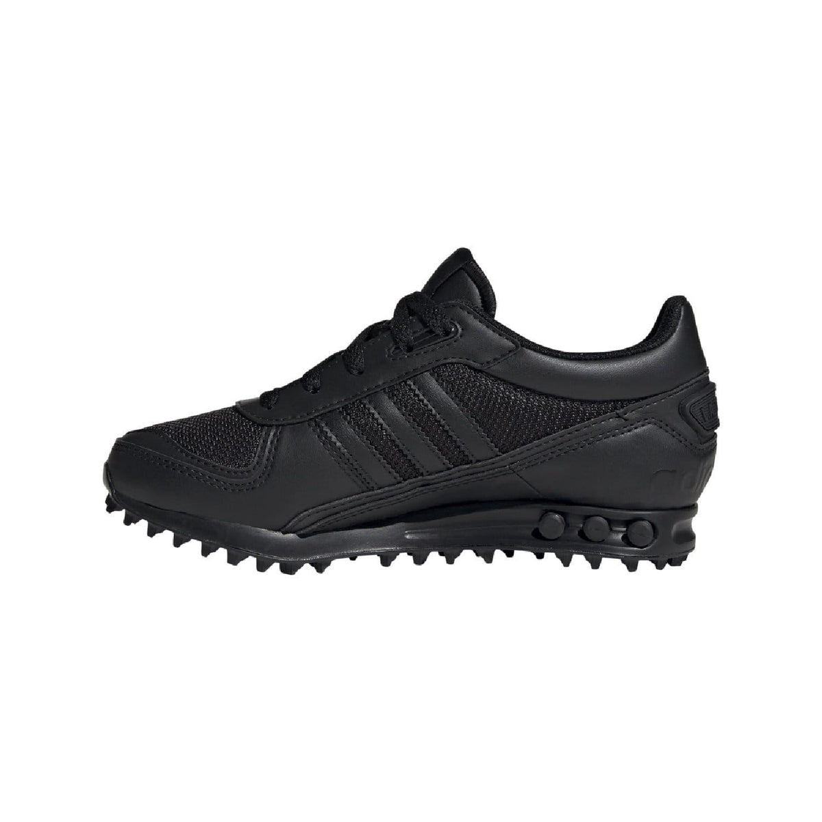Adidas Originals LA Trainer II juniors black trainer side view with tread and studs