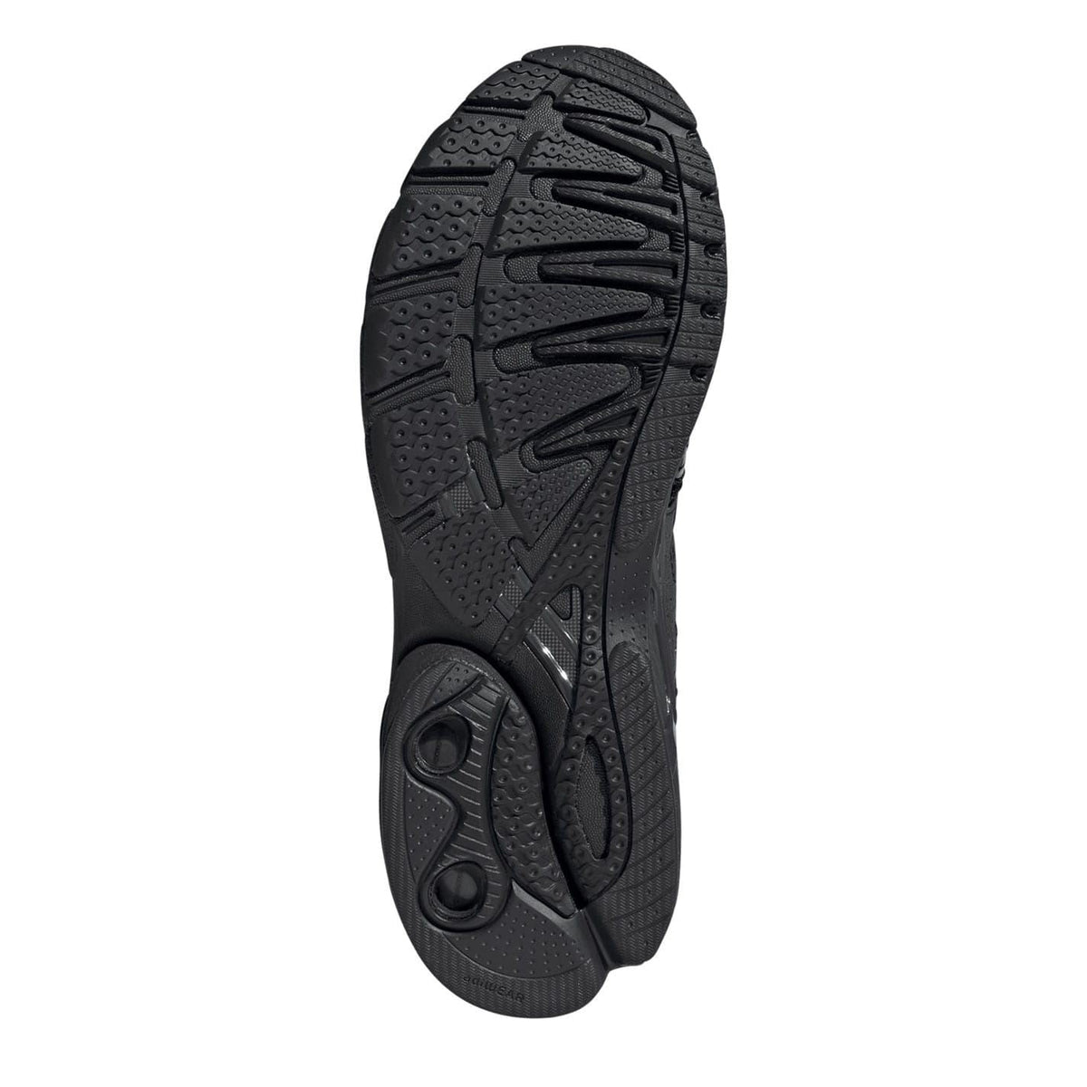 Black sneaker outsole view with circular traction pods and deep tread