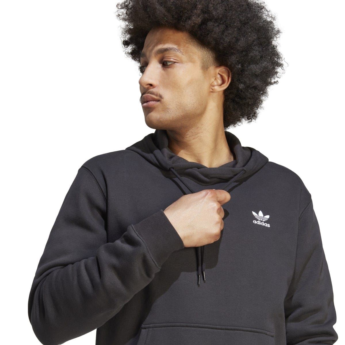 Black adidas hoodie close-up with Trefoil logo and drawstring hood