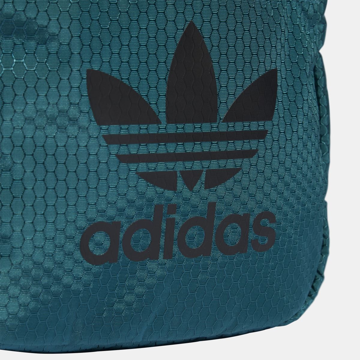 Teal adidas Originals small item bag close-up of trefoil logo and adidas lettering