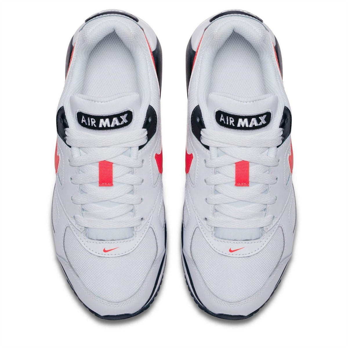 White boys' Air Max sneakers, front view with Air Max tongue labels and red lace tabs