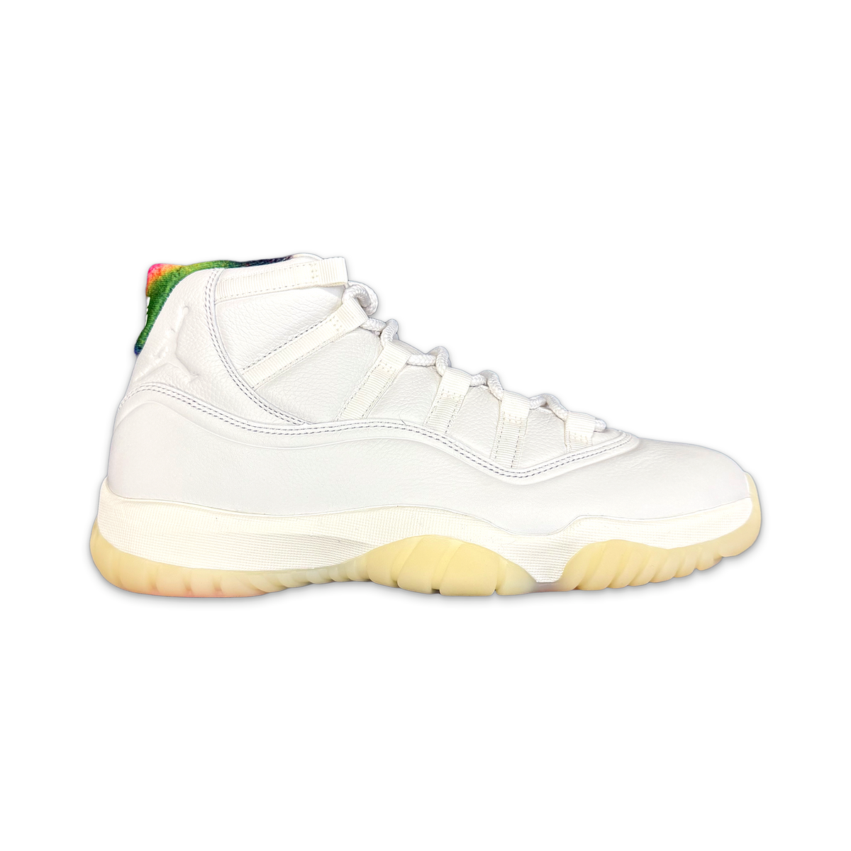 Air Jordan 11 Retro mid-top sneakers: white leather, yellow outsole, green heel accent.