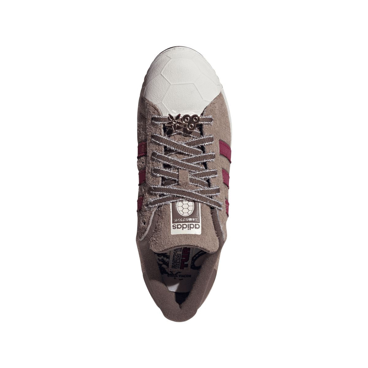 adidas Originals Teenage Mutant Ninja Turtles Superstar trainers featuring colorful turtle-themed design and classic sneaker style.
