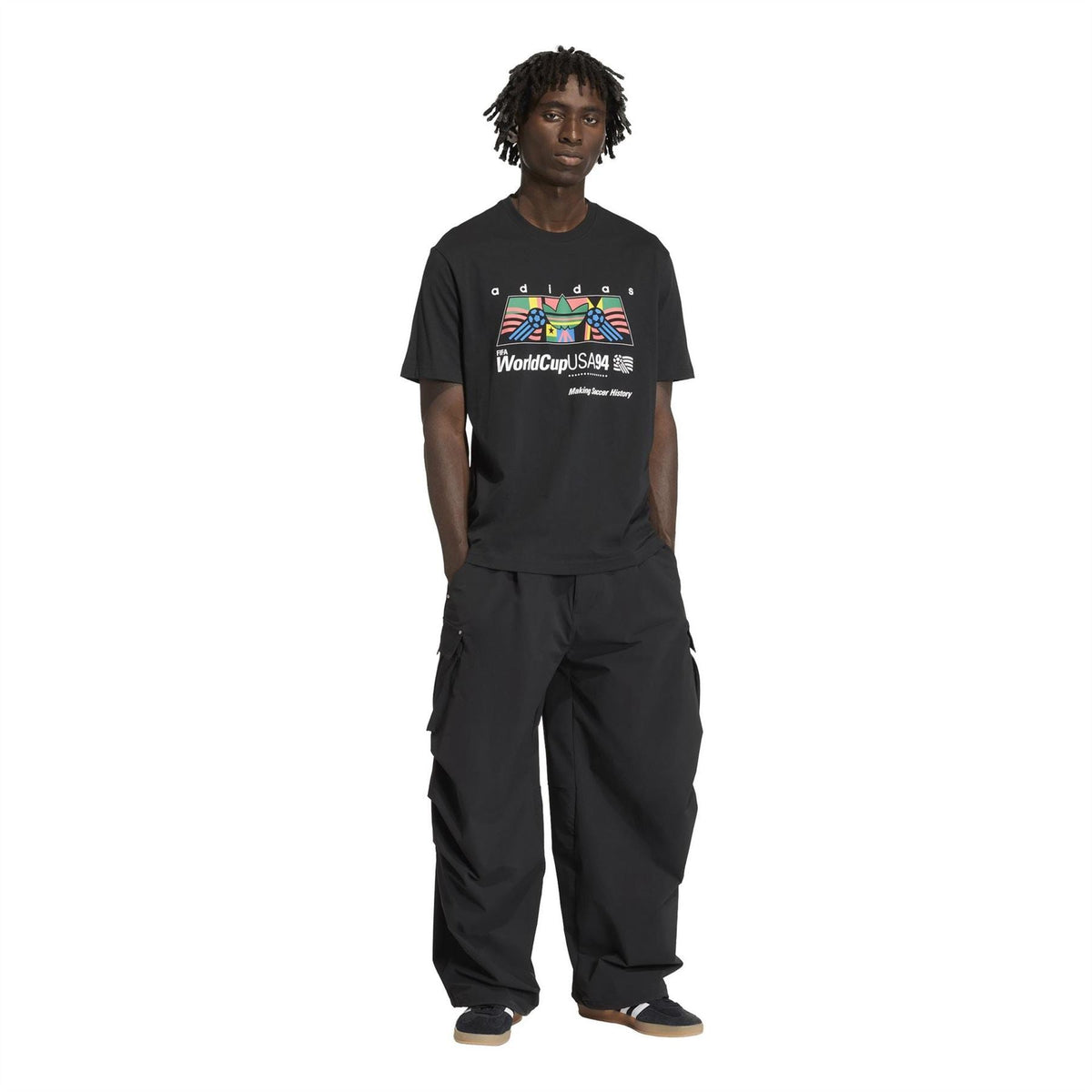 Black crew-neck T-shirt with WorldCupUSA94 adidas chest graphic worn with black pants