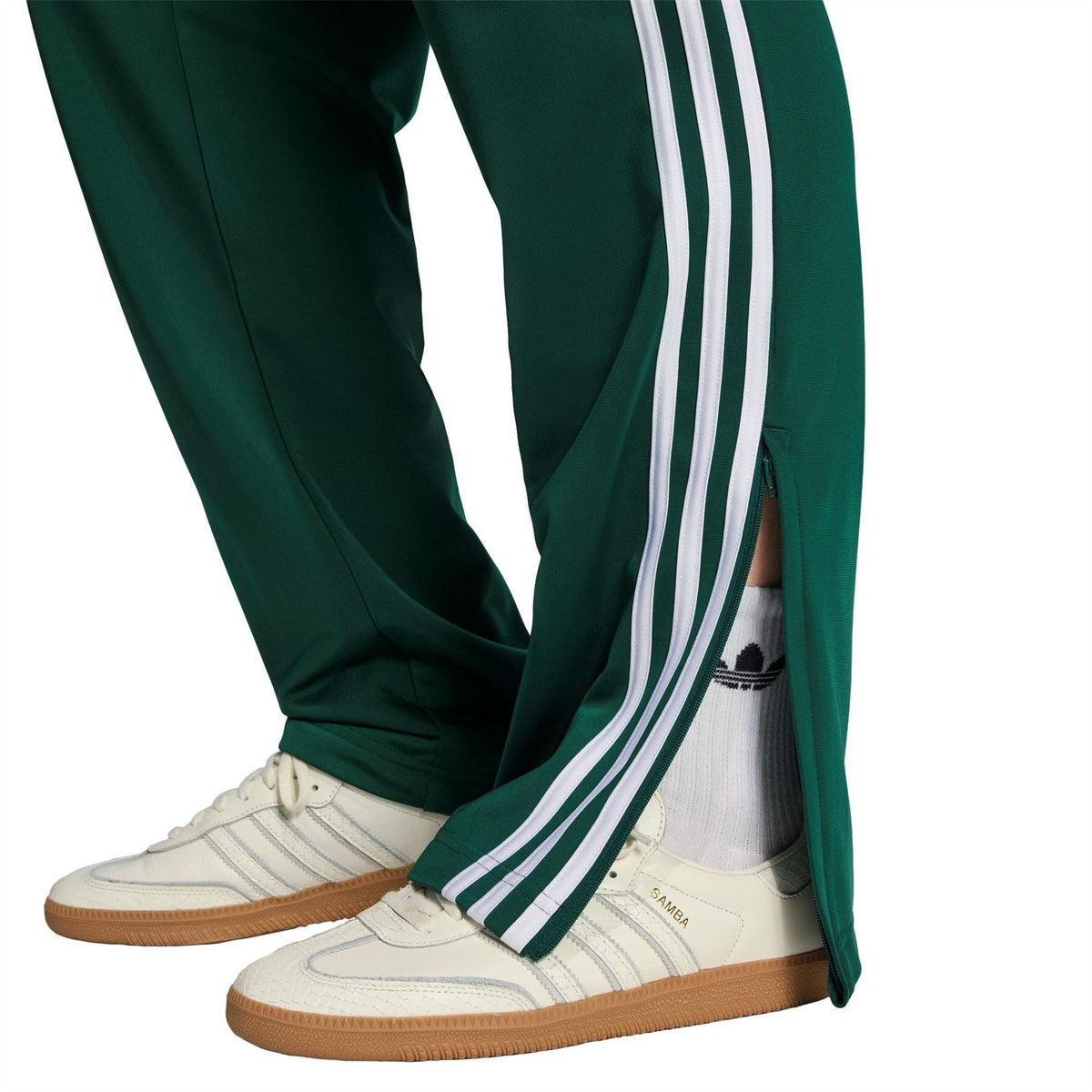 Men's dark green track joggers with white side stripes and open cuff at ankle