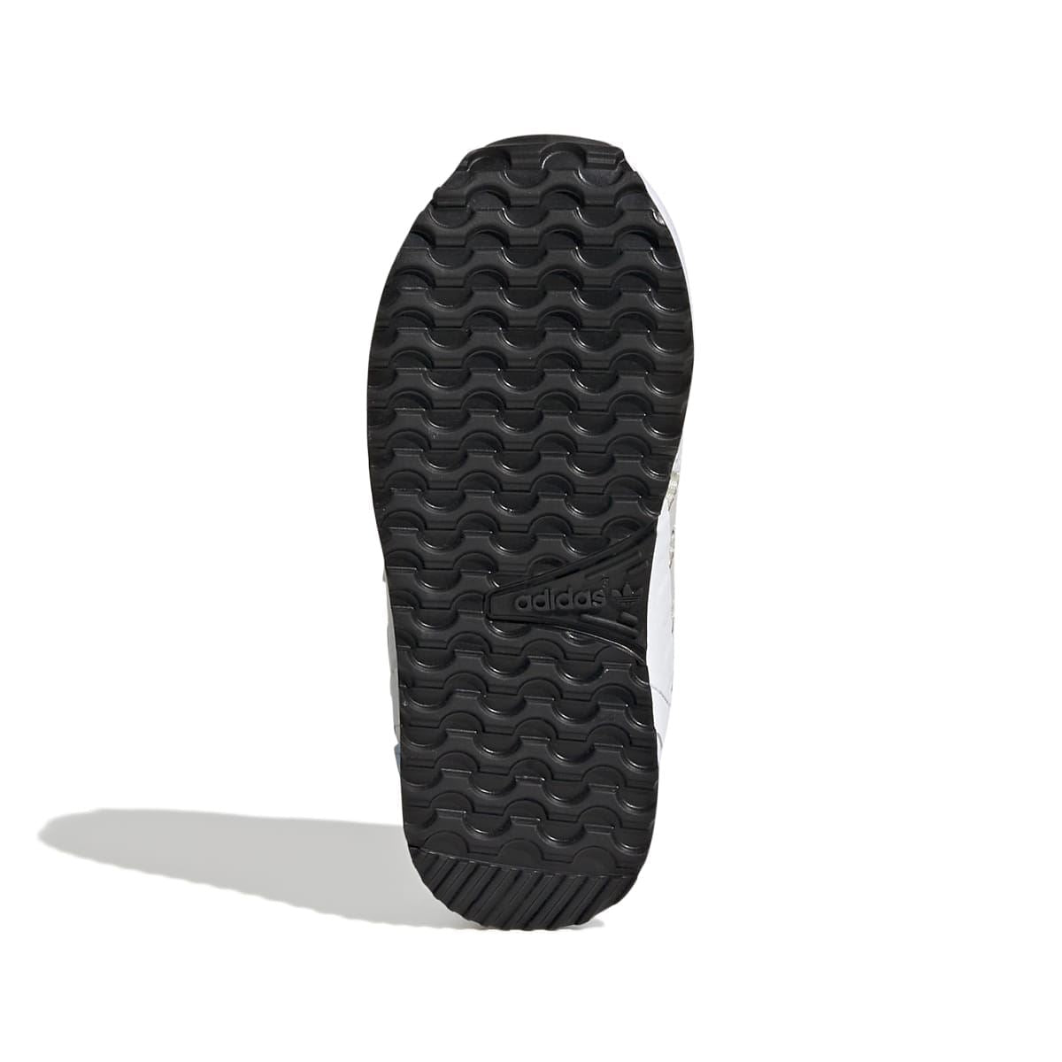 Infant trainer outsole with black tread pattern and small adidas logo near the heel