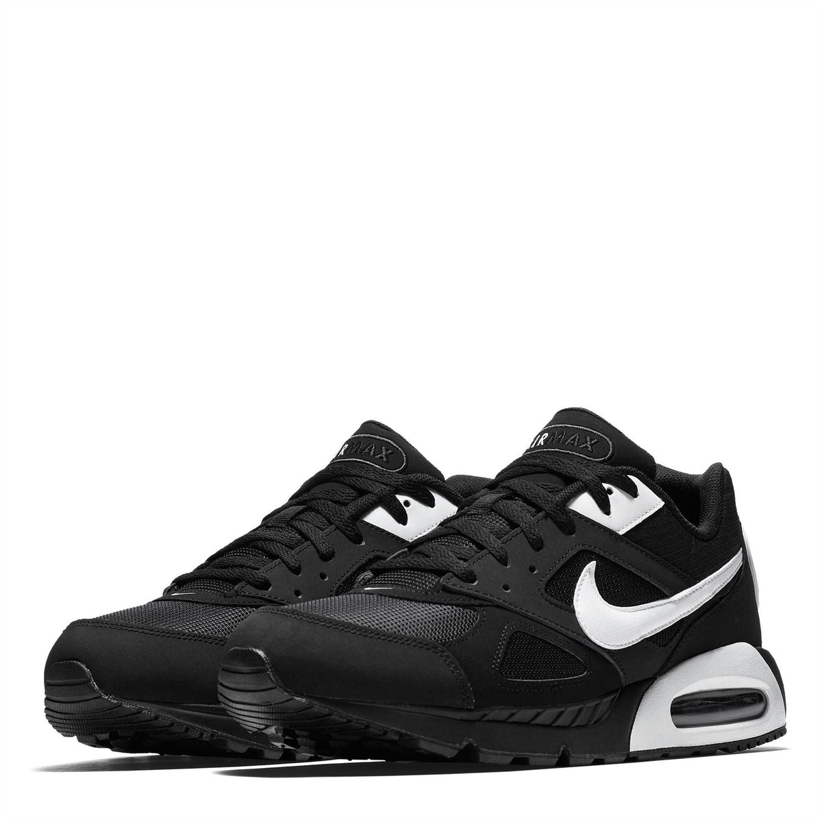 Black trainers with white swoosh accents and low-profile air unit midsole