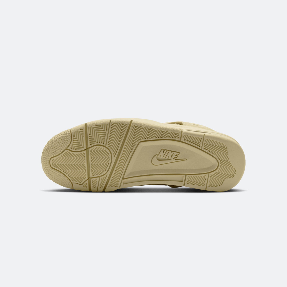 Yellow sneaker outsole view with traction pattern and Nike branding