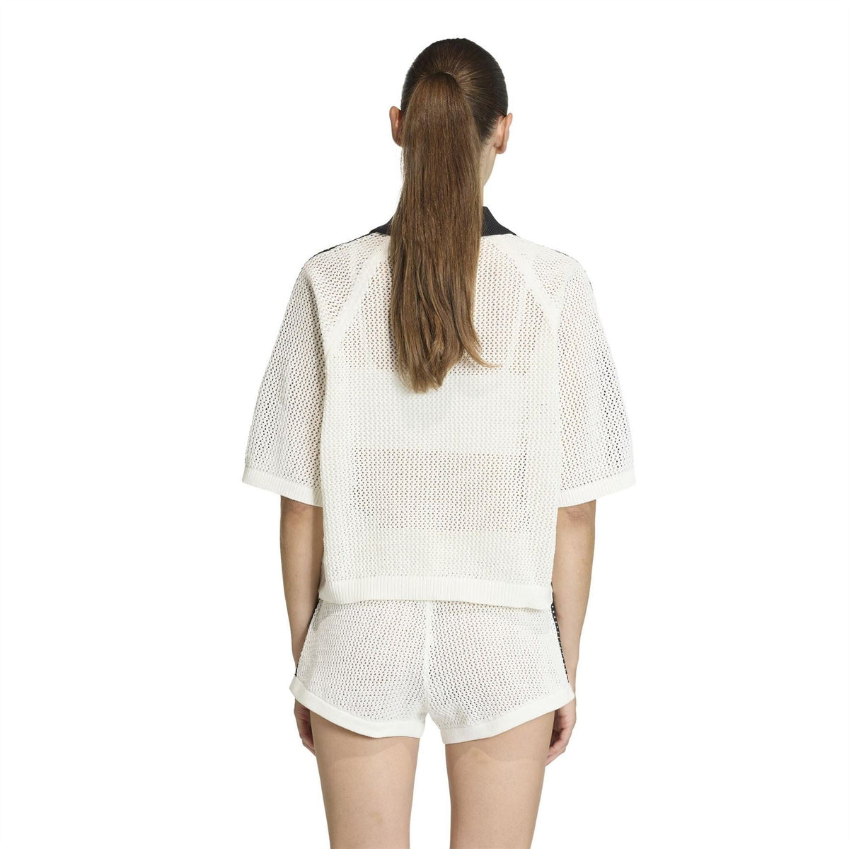 Off-white knit polo shirt, back view with black-trim collar