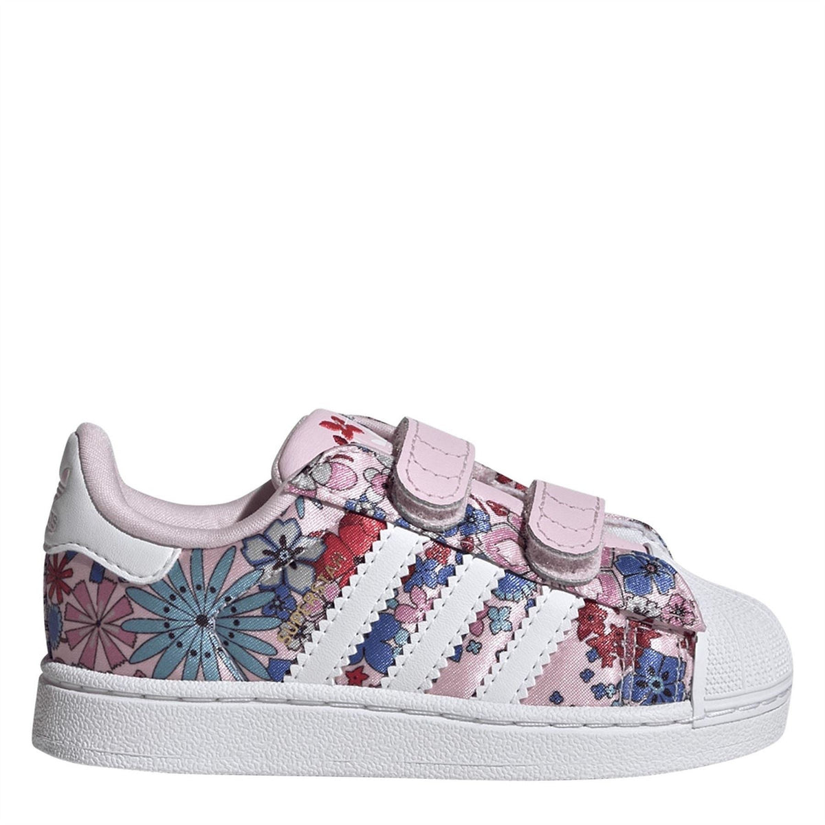 Pink and white kids' low-top sneakers with hook-and-loop straps and floral print