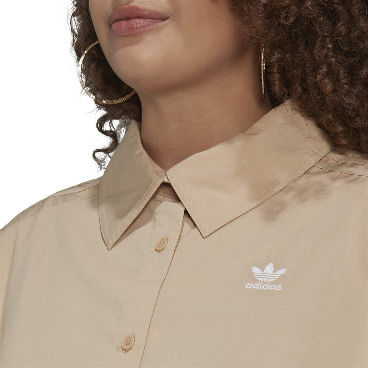 Beige long-sleeve shirt close-up of pointed collar and adidas Trefoil logo