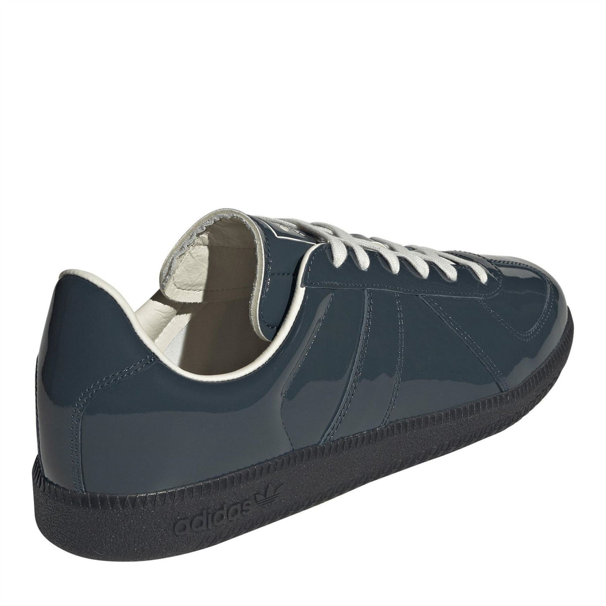 Dark petrol blue adidas sneakers with padded collar and white-striped lace-up closure