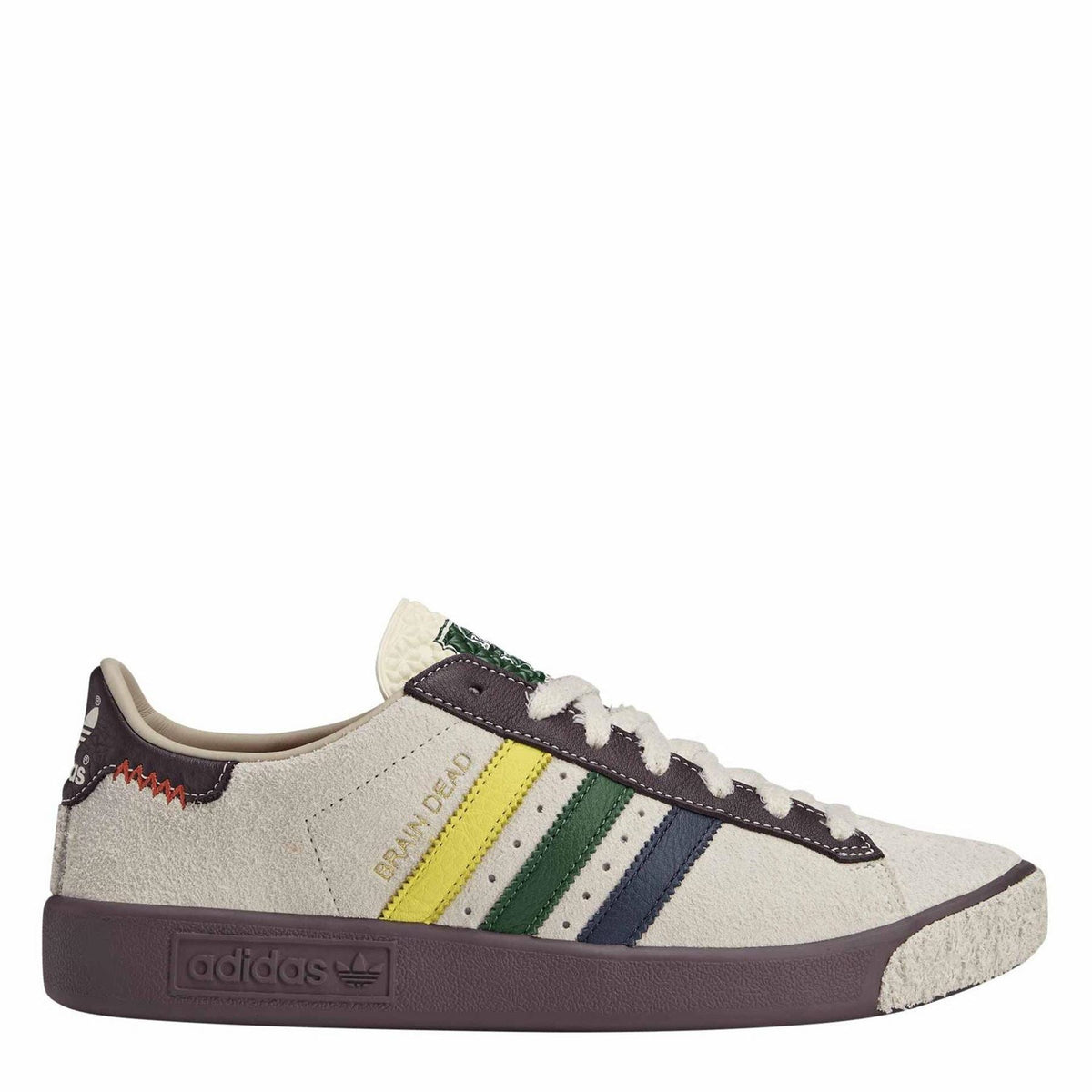 Low-top canvas sneakers with multicolor Adidas stripes, dark laces and rubber sole