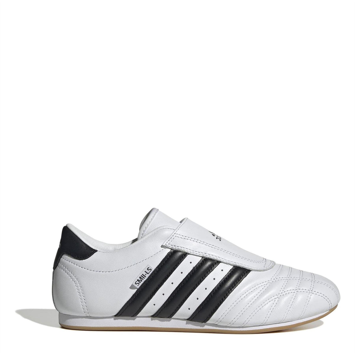 White low-top trainers with black stripes, hook-and-loop strap, adidas logo