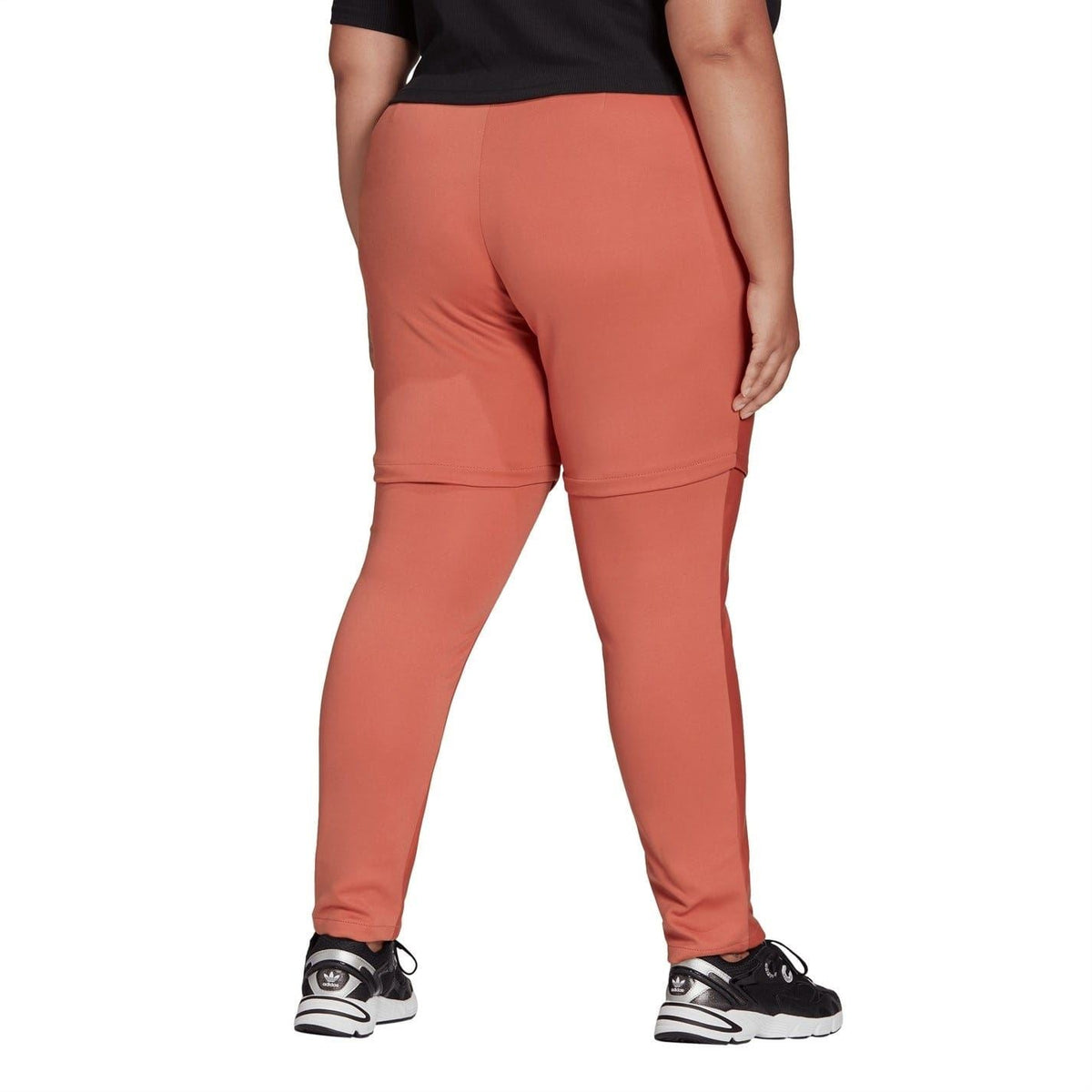 adidas slim-fit jogger sweatpants, rust-red tapered legs with elastic ankle cuffs