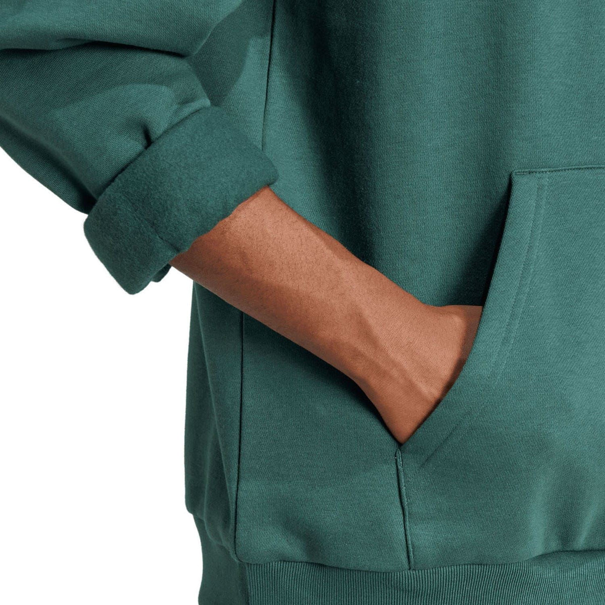 Green adidas Originals hoodie close-up of kangaroo pocket and ribbed hem