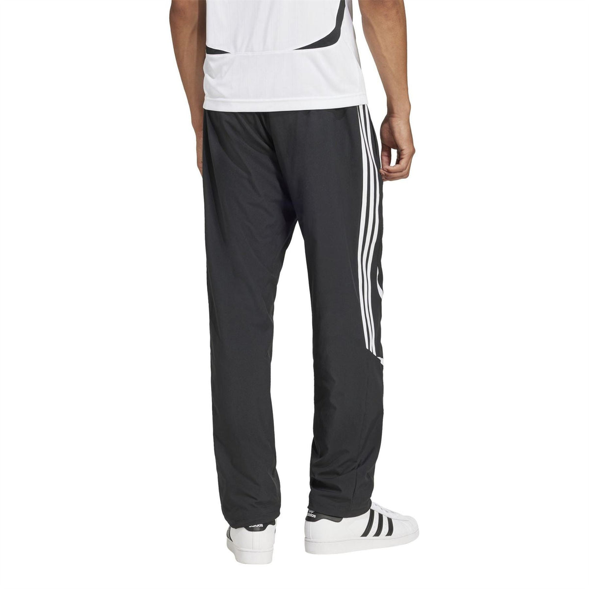 adidas Originals black track pants with three white stripe panels and ankle cuffs