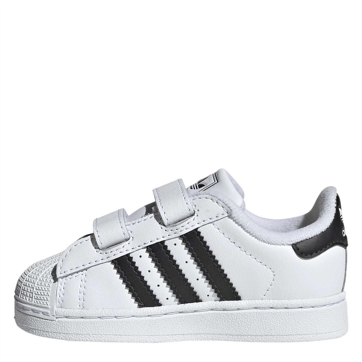 White low-top sneakers with two adjustable velcro straps and black three stripes