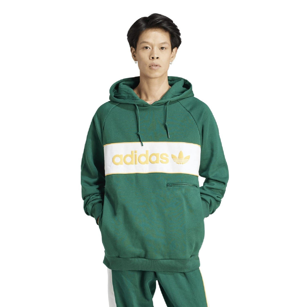 Green adidas Originals hoodie worn by a model, with hood and white logo band