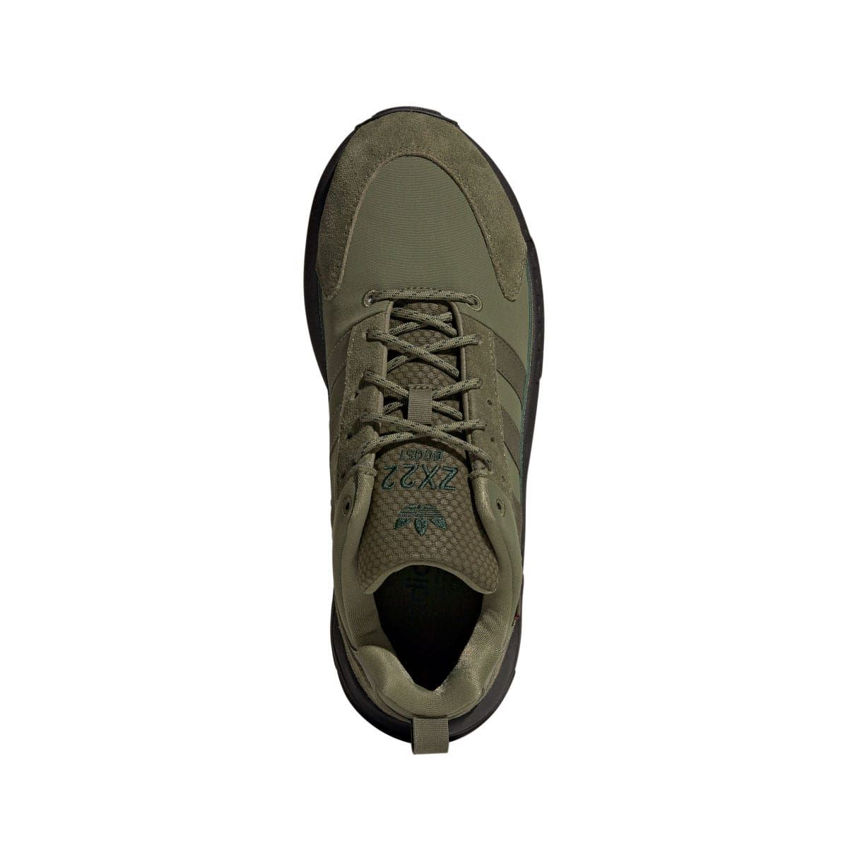 Olive lace-up trainer with cushioned tongue and dark collar lining