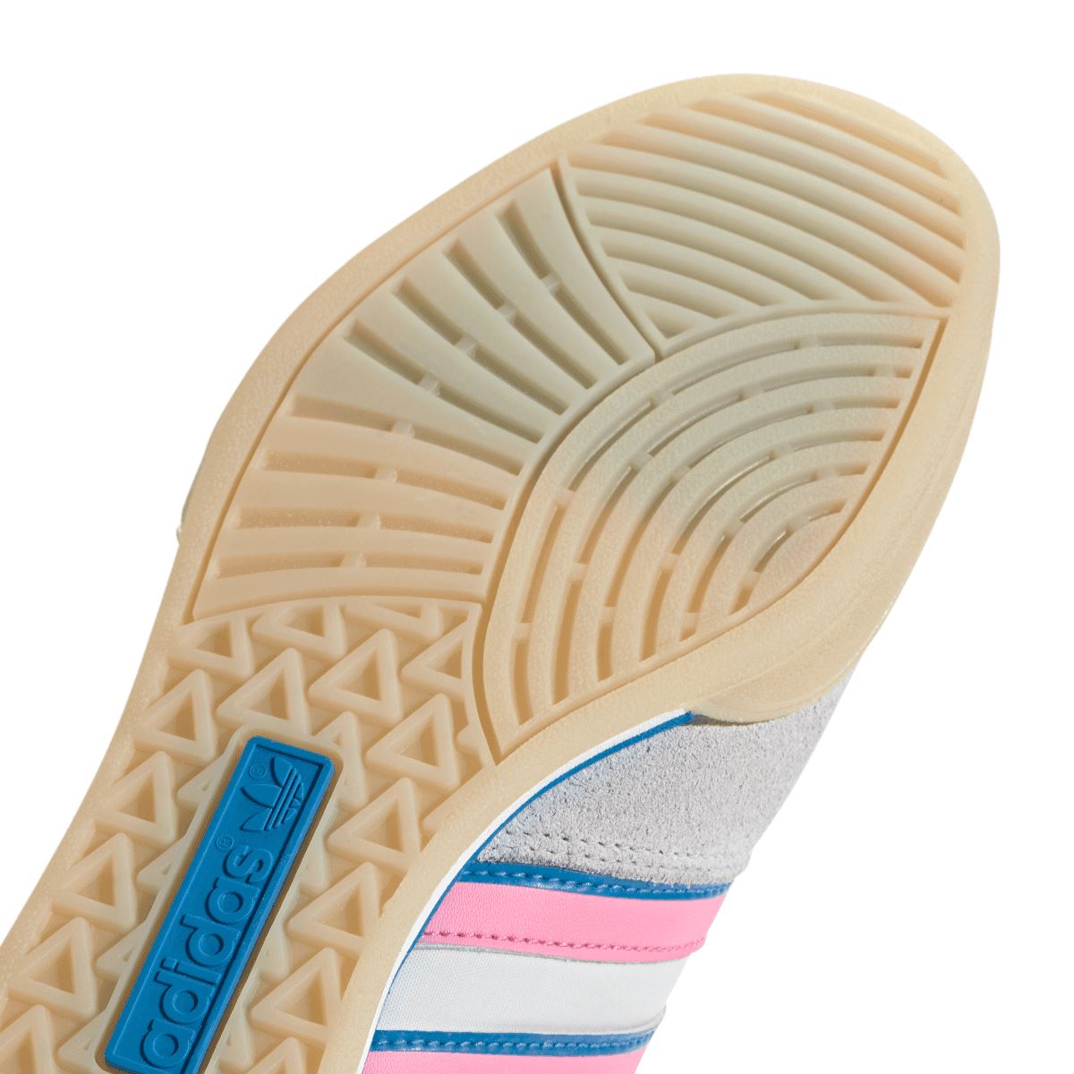 adidas Originals indoor sneaker outsole close-up with geometric tread and blue logo tab