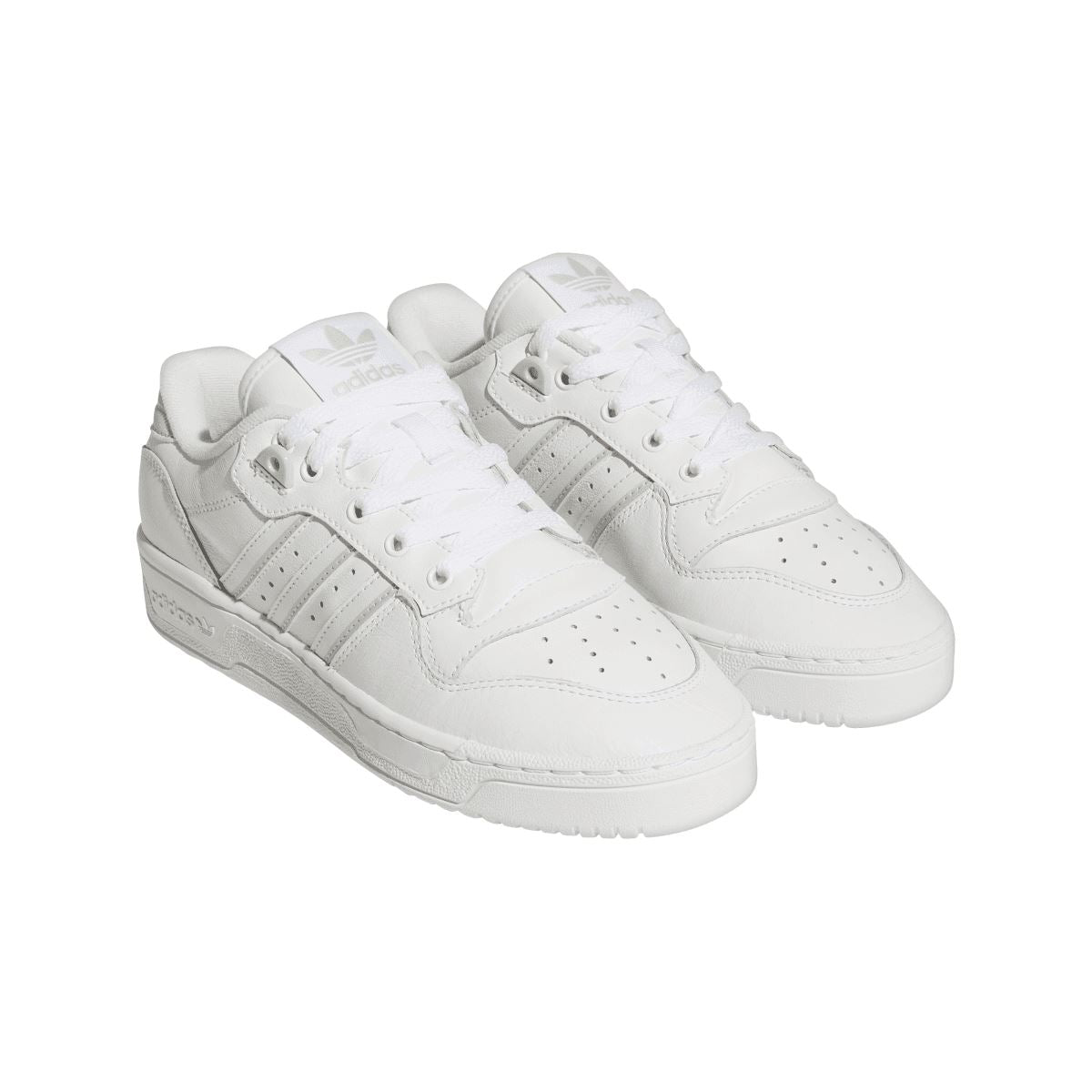 White low-top trainers shown from above, featuring lace-up design and three stripes