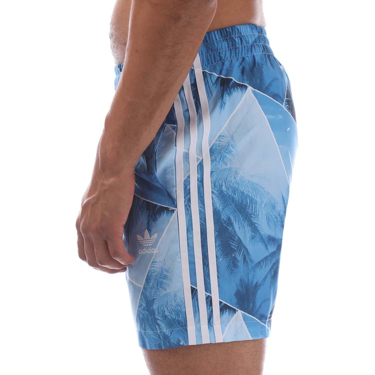 adidas Originals Palm swim shorts with tropical print, featuring drawstring waist and lightweight fabric for beach and poolwear.