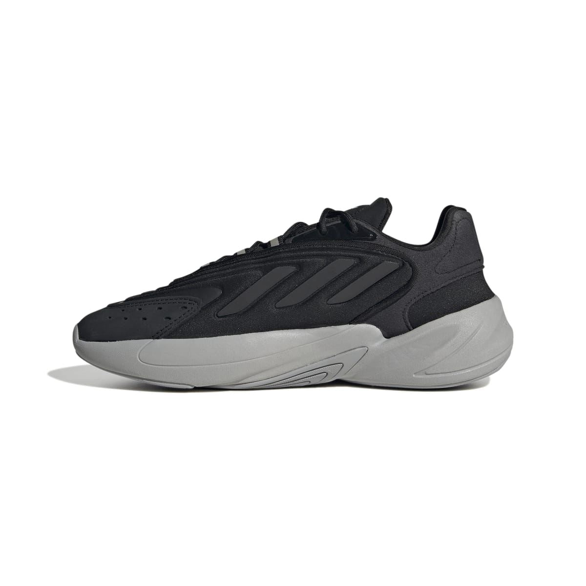Black and gray lace-up trainers with perforated toe and sculpted midsole