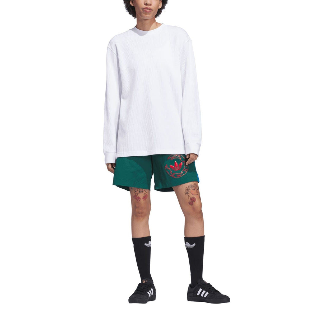 Green water shorts with red logo graphic, elastic waistband and drawstring