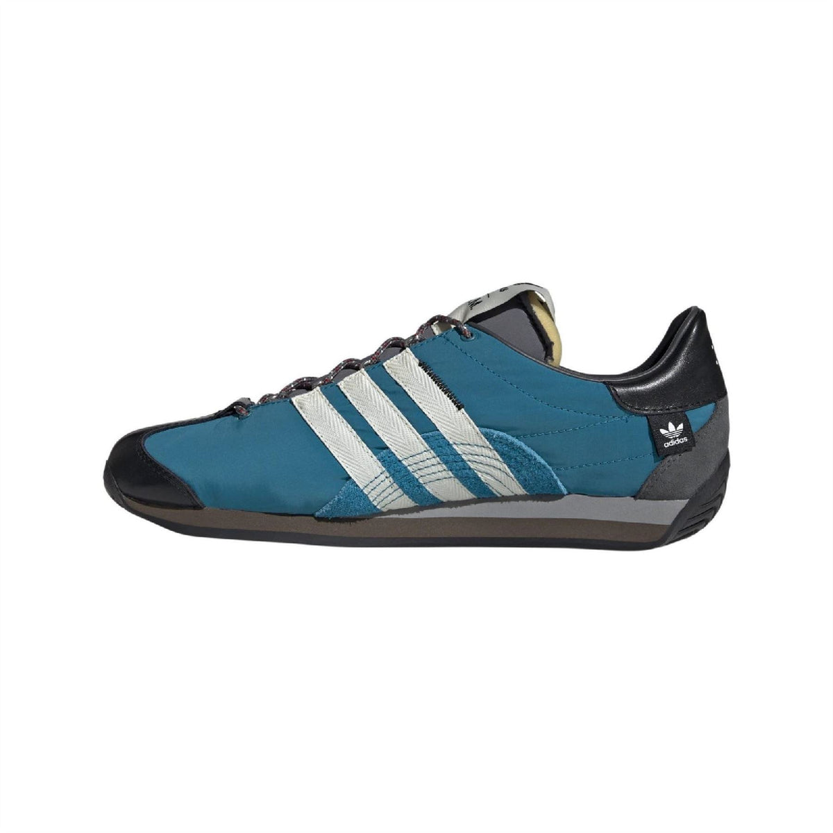 Teal low-top sneakers with white three stripes, black heel, and lace-up design