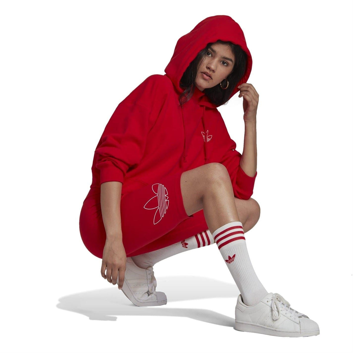 Red slim-fit biking athletic shorts with adidas trefoil graphic on leg