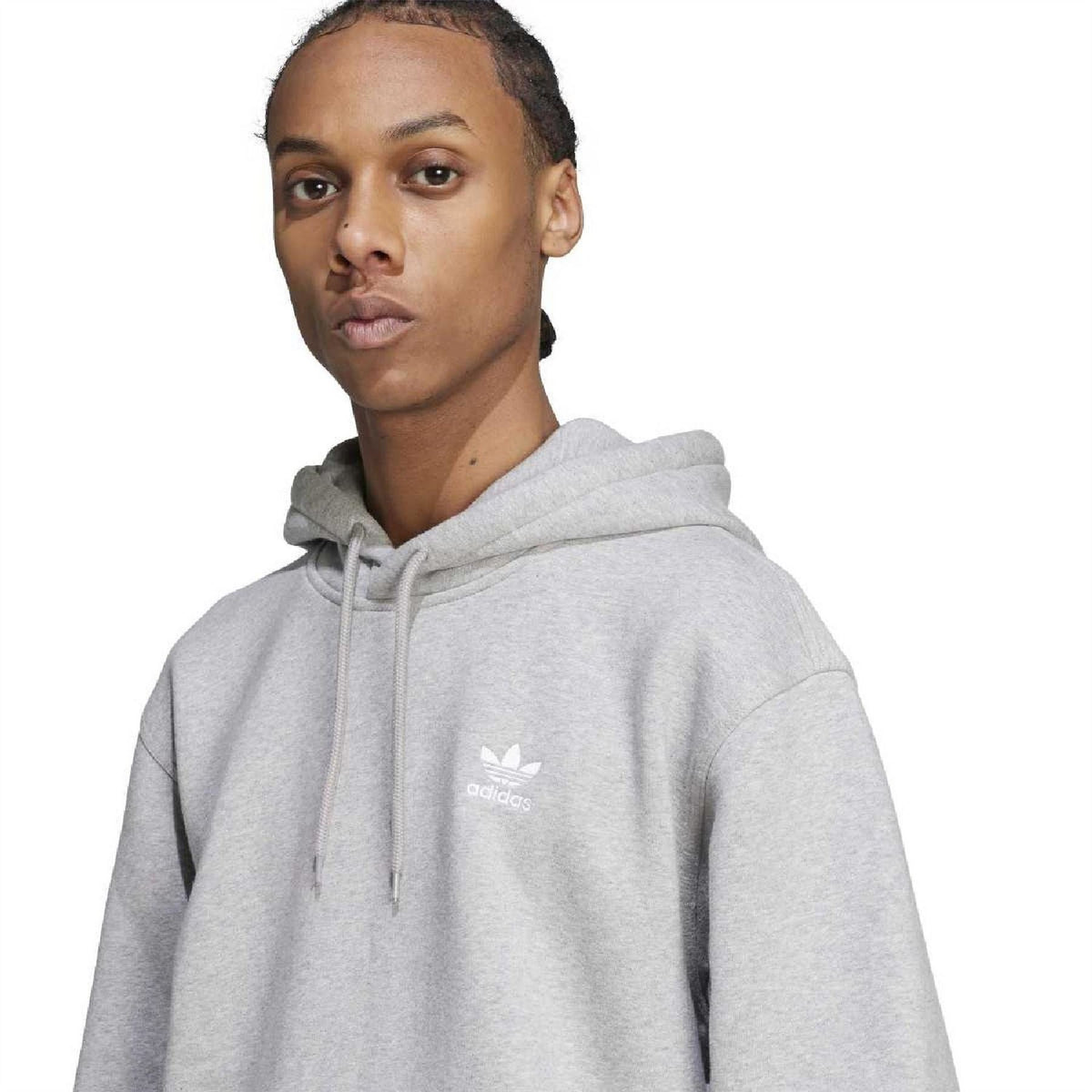 Grey hoodie close-up with adidas logo on chest and drawstring hood