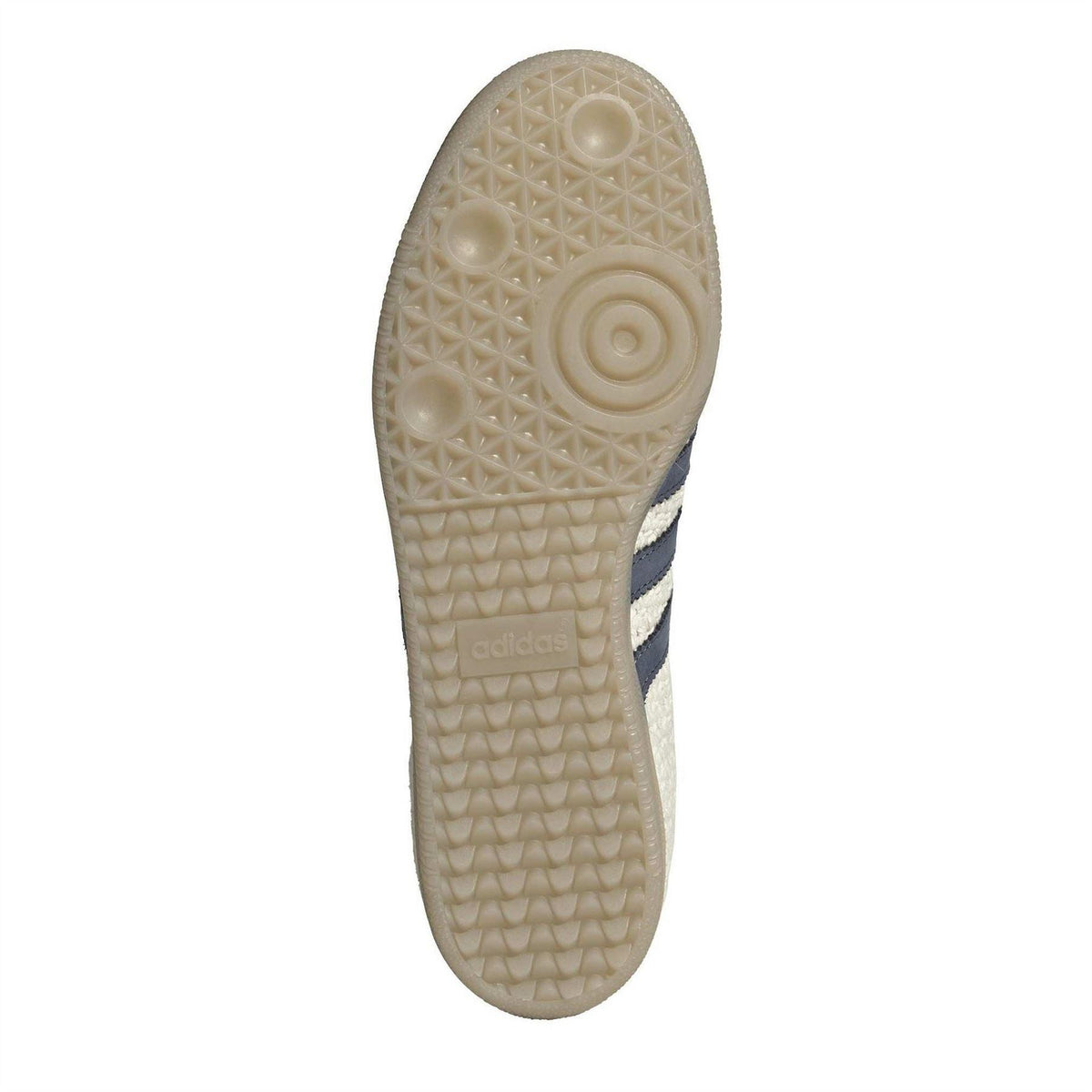 Cream rubber outsole with textured traction pattern and adidas logo