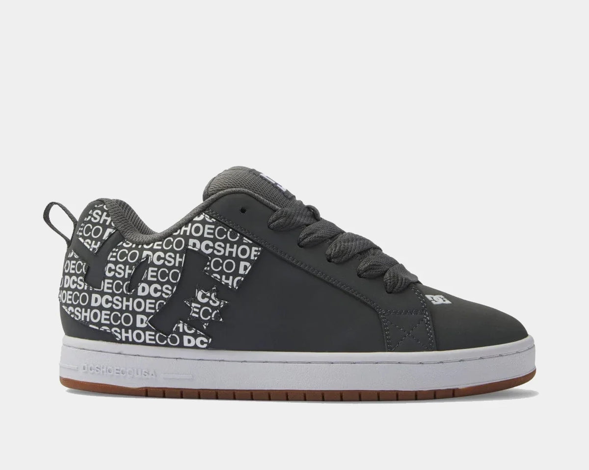 Dark grey low-top sneakers with patterned collar, lace-up front and DC side logo