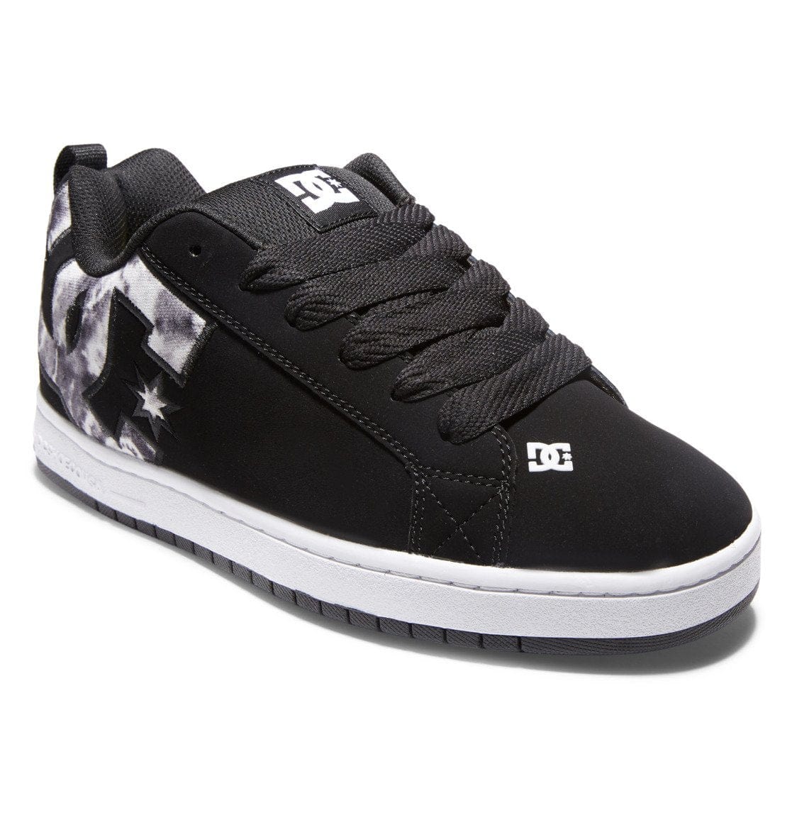 Black low-top sneakers with lace-up closure, star print panels, and DC logo