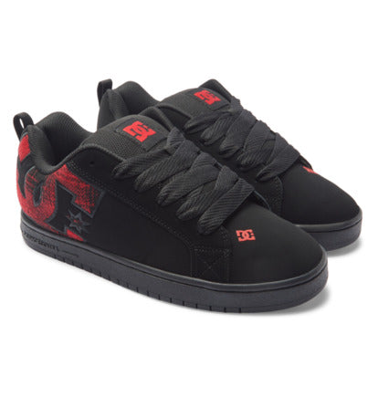 Pair of black low-top sneakers with red printed details, star logos, and black laces