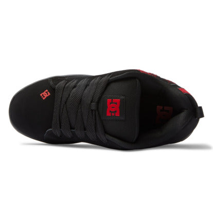 Black sneaker interior side view with black laces and red DC logo on heel