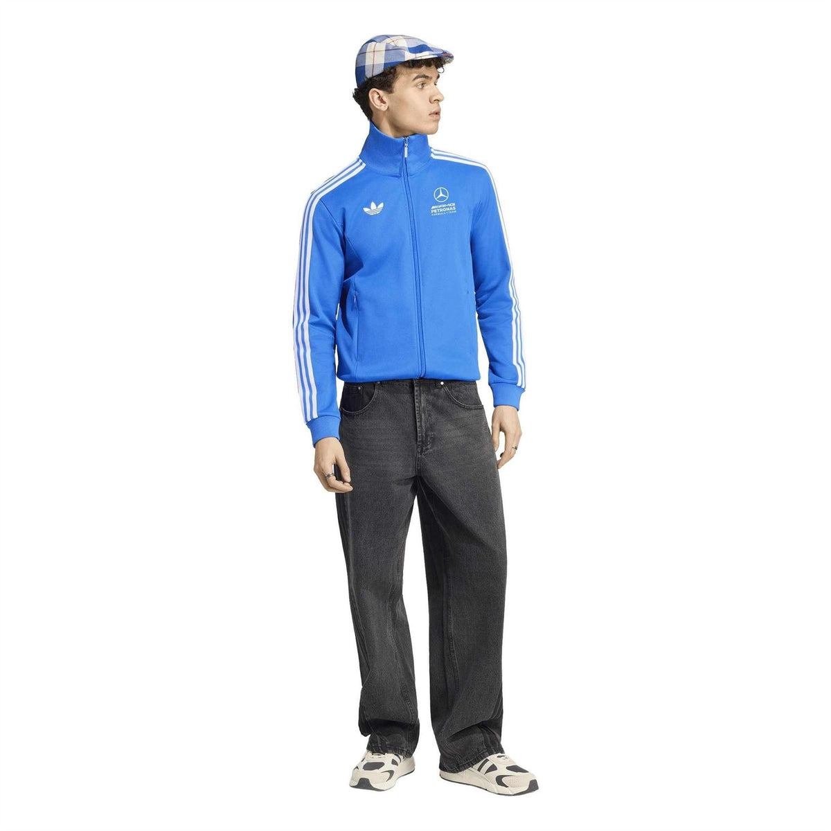 Blue track jacket with white adidas sleeve stripes, worn with dark jeans