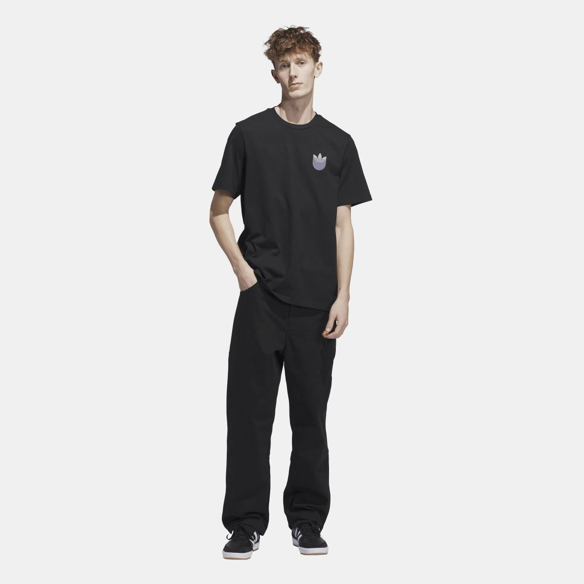 Black short-sleeve t-shirt with chest trefoil shadow logo on model