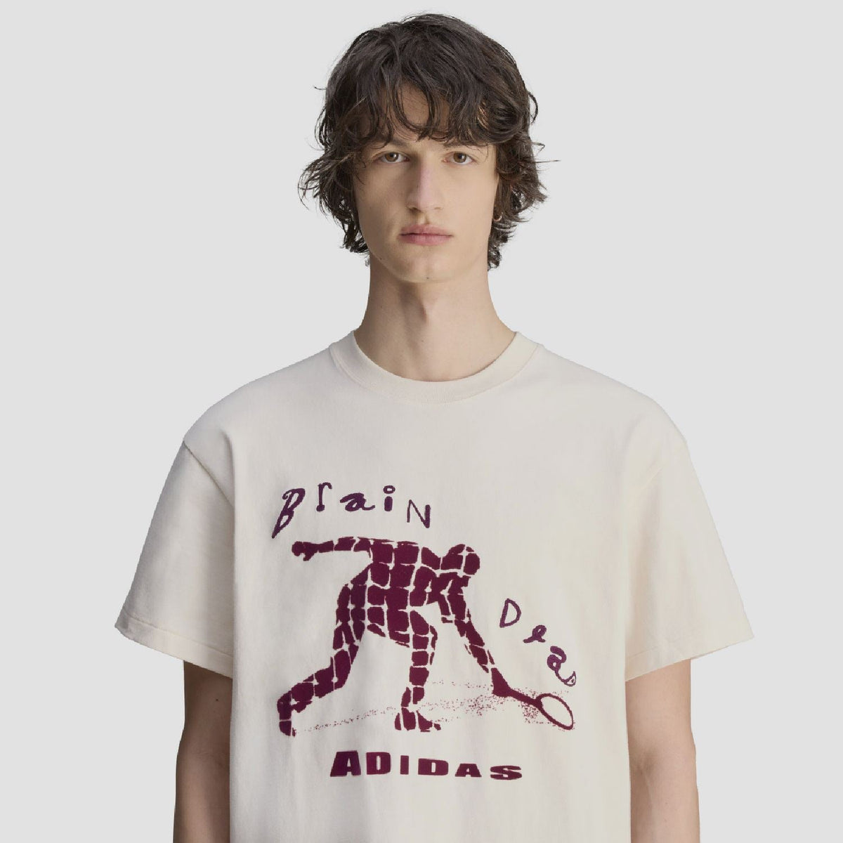 Cream T-shirt with purple robot graphic and 'ADIDAS' lettering on front