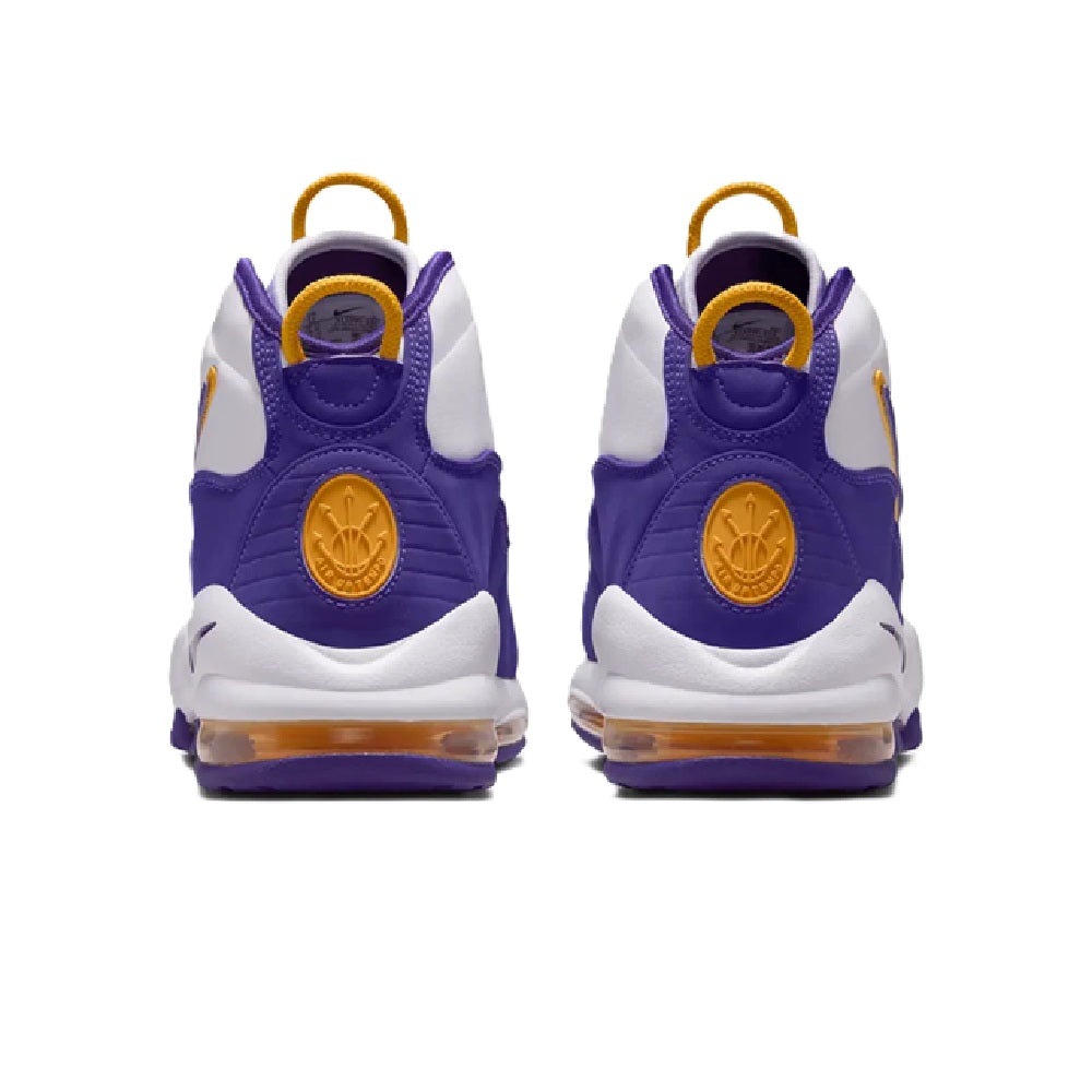 High-top sneakers heel view in purple and white with gold logo patch and yellow pull tabs