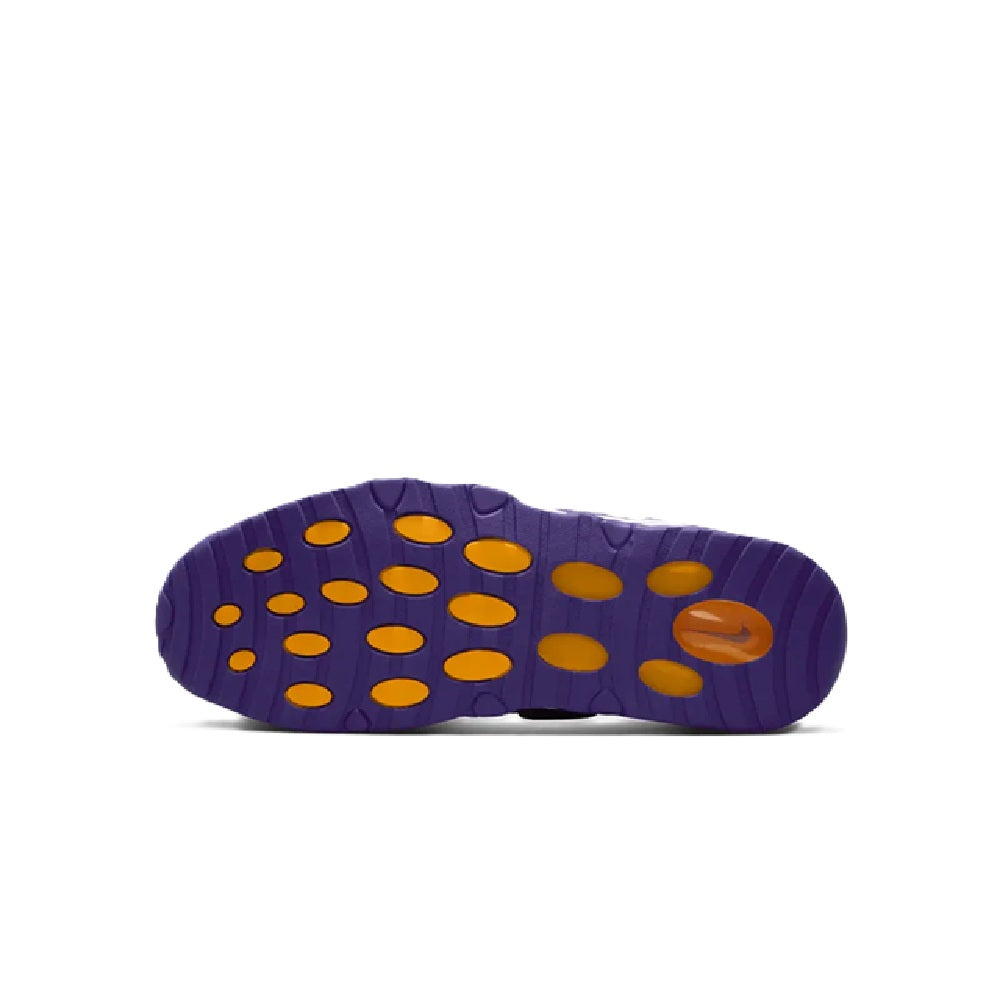 Sneaker outsole with purple tread and orange dotted pattern and logo