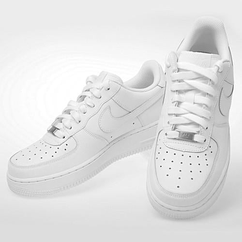 Kids Nike Air Force 1 LE white sneakers, side view with swoosh and lace tips