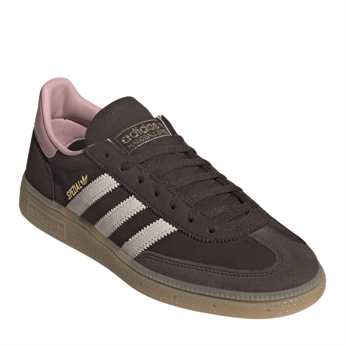Black adidas Spezial sneakers with white stripes, pink tongue lining, lace-up.