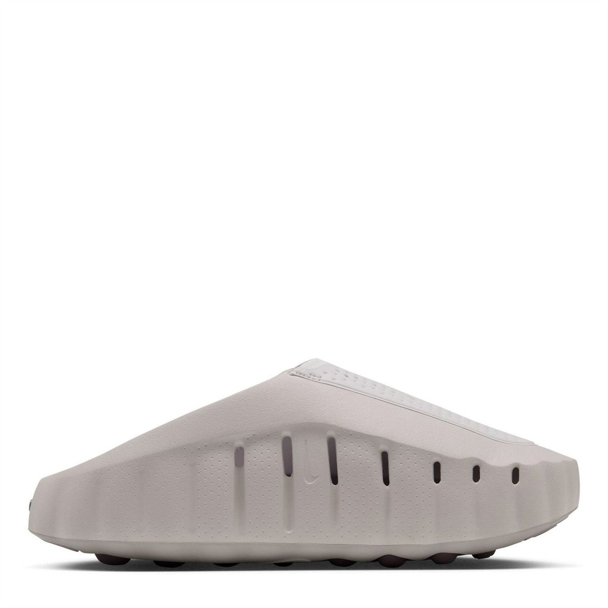 Light gray rubber outsole with raised traction ridges and nubs